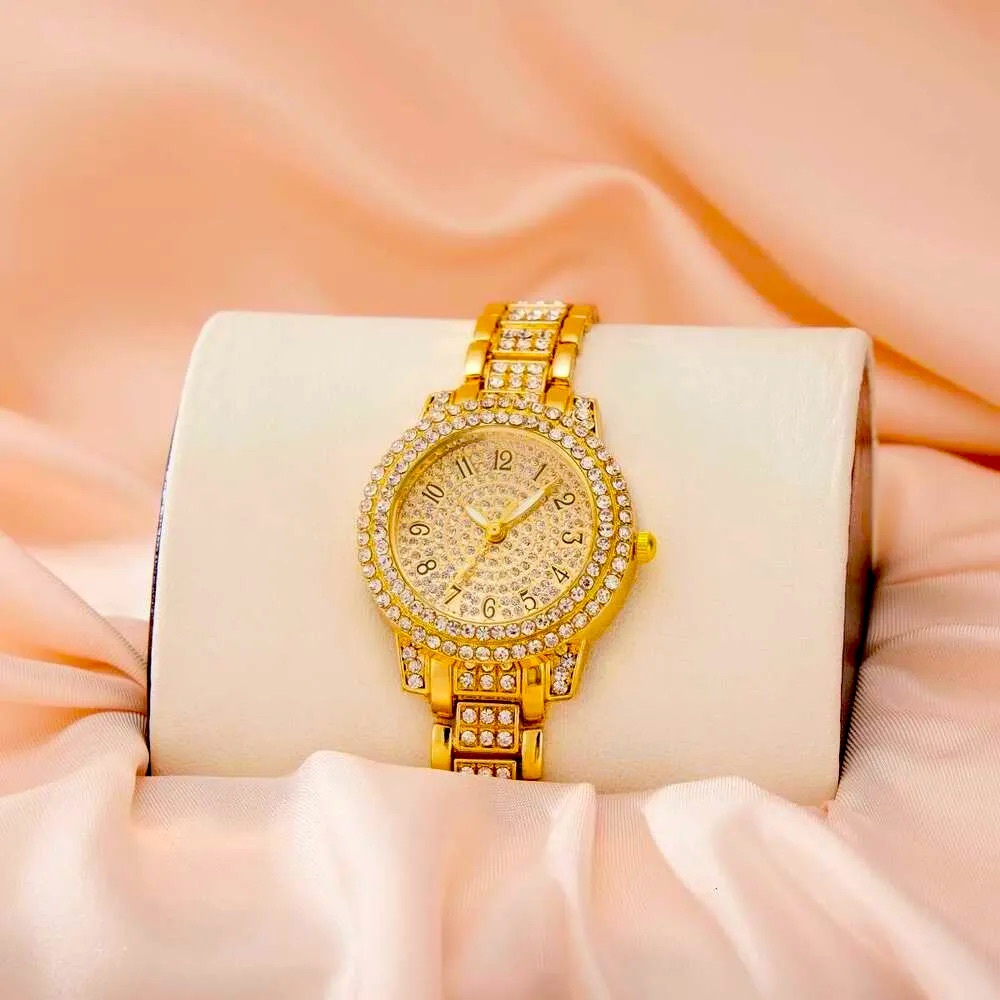 Beautiful, watch gold with diamonds around the band fave and case. Beautiful